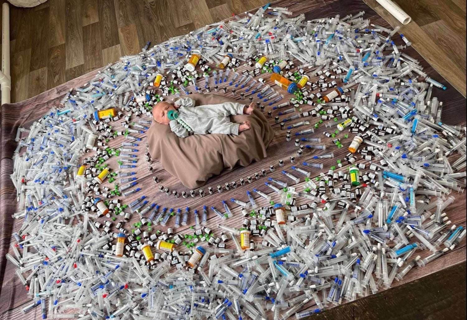 Elijah surrounded by all the injections and medications used while mum was pregnant with him