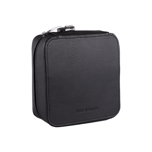 A black medication bag with a zipper, branded by Tiny Hearts, designed for carrying child medication.